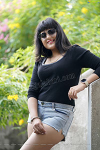 Richa Kalra in Black Top and Denim Shorts