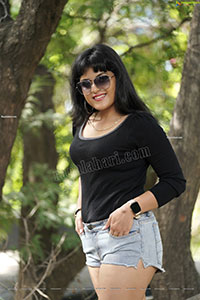 Richa Kalra in Black Top and Denim Shorts