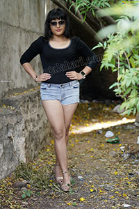Richa Kalra in Black Top and Denim Shorts
