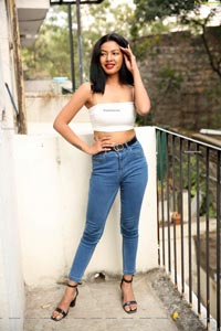 Kavita Mahatho in White Spaghetti Strap Crop Top and Jeans