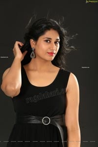 Akhila Ram in Black Sleeveless Tank High-Low-Hem Dress