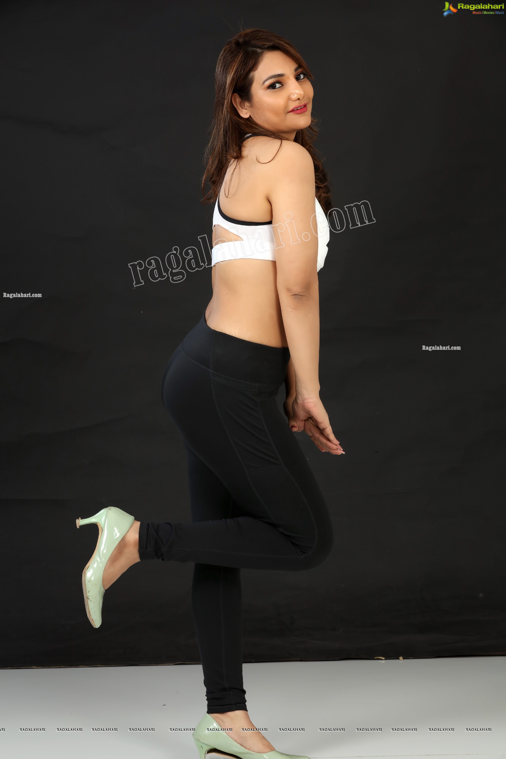 Nisha Singh Rajput in Black Package Hip Mini Skirt and White Spaghetti Strap Crop Top Exclusive Photo Shoot