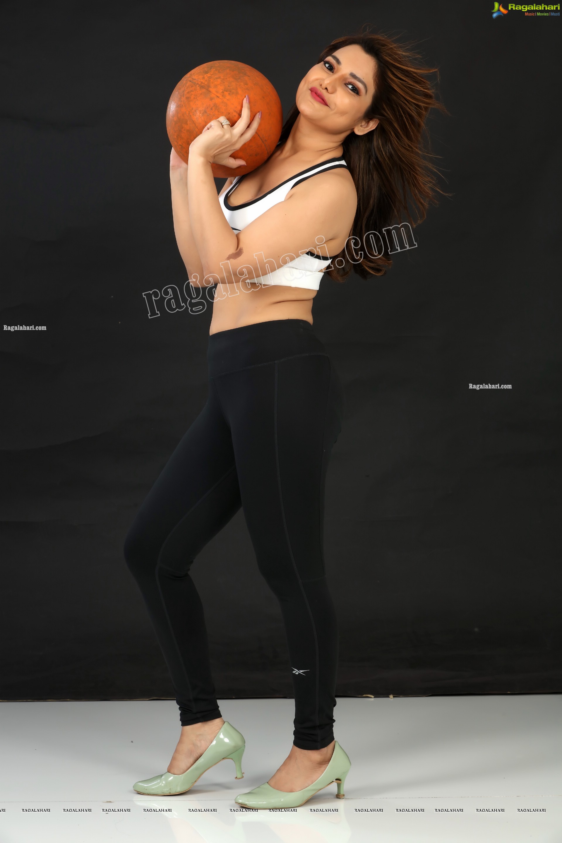 Nisha Singh Rajput in Black Package Hip Mini Skirt and White Spaghetti Strap Crop Top Exclusive Photo Shoot