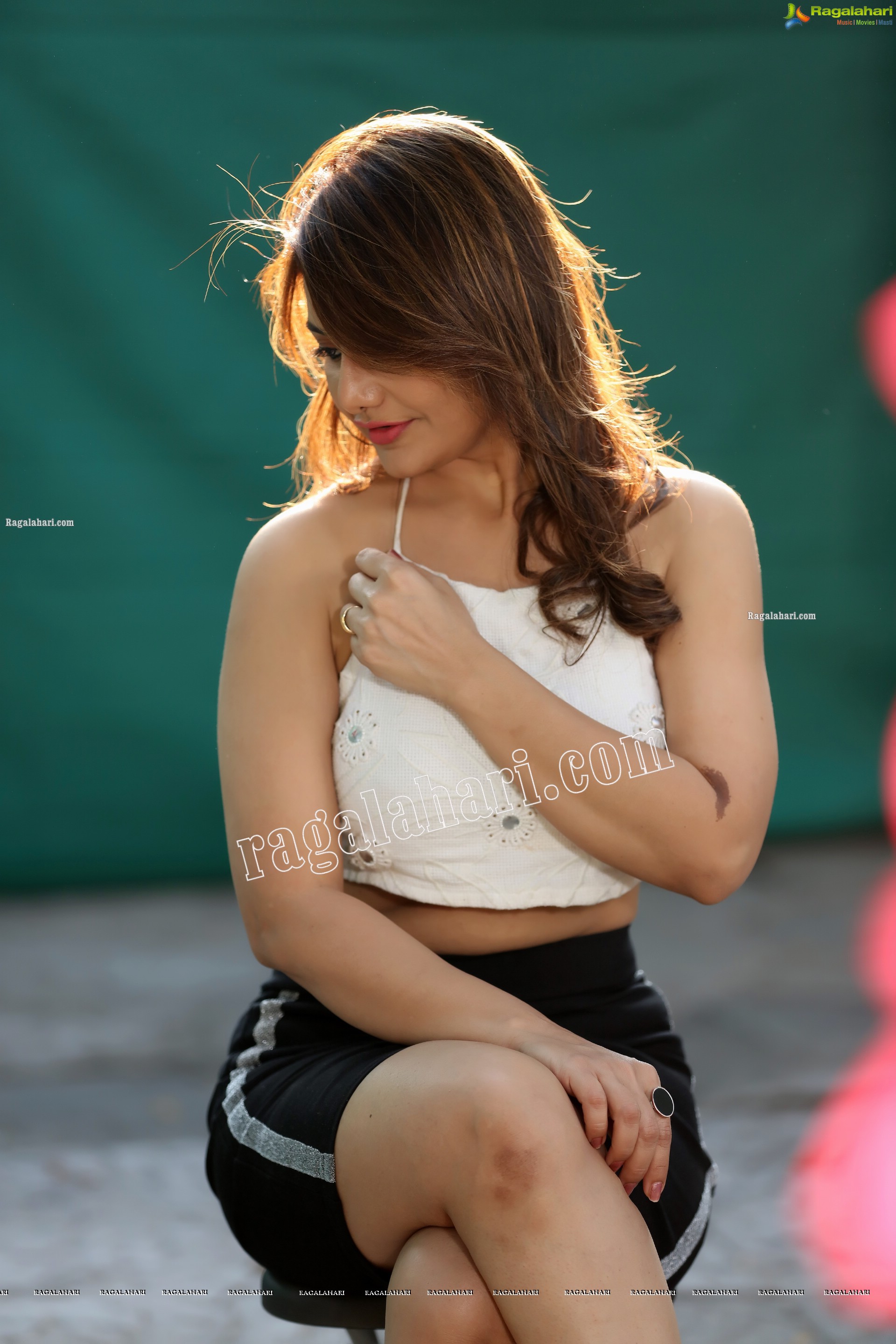 Nisha Singh Rajput in Black Package Hip Mini Skirt and White Spaghetti Strap Crop Top Exclusive Photo Shoot