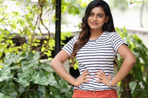 Priyanka Augustin in White Striped Top and Shorts