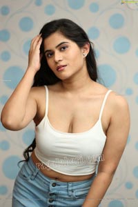 Tara Chowdary in White Spaghetti Strap Crop Top and Jeans