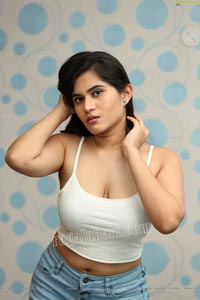 Tara Chowdary in White Spaghetti Strap Crop Top and Jeans