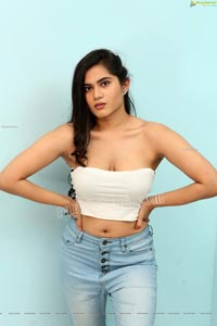 Tara Chowdary in White Spaghetti Strap Crop Top and Jeans