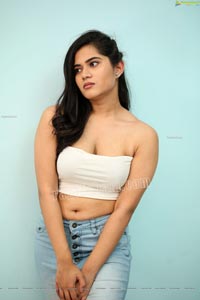 Tara Chowdary in White Spaghetti Strap Crop Top and Jeans