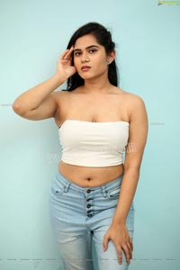 Tara Chowdary in White Spaghetti Strap Crop Top and Jeans