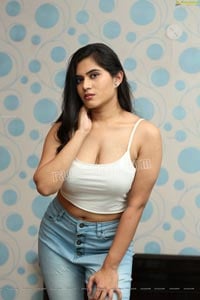 Tara Chowdary in White Spaghetti Strap Crop Top and Jeans