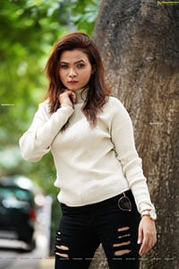 Pranita Waghchoure in White Ribbed Turtle-Neck Pullover