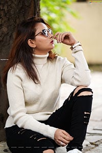 Pranita Waghchoure in White Ribbed Turtle-Neck Pullover