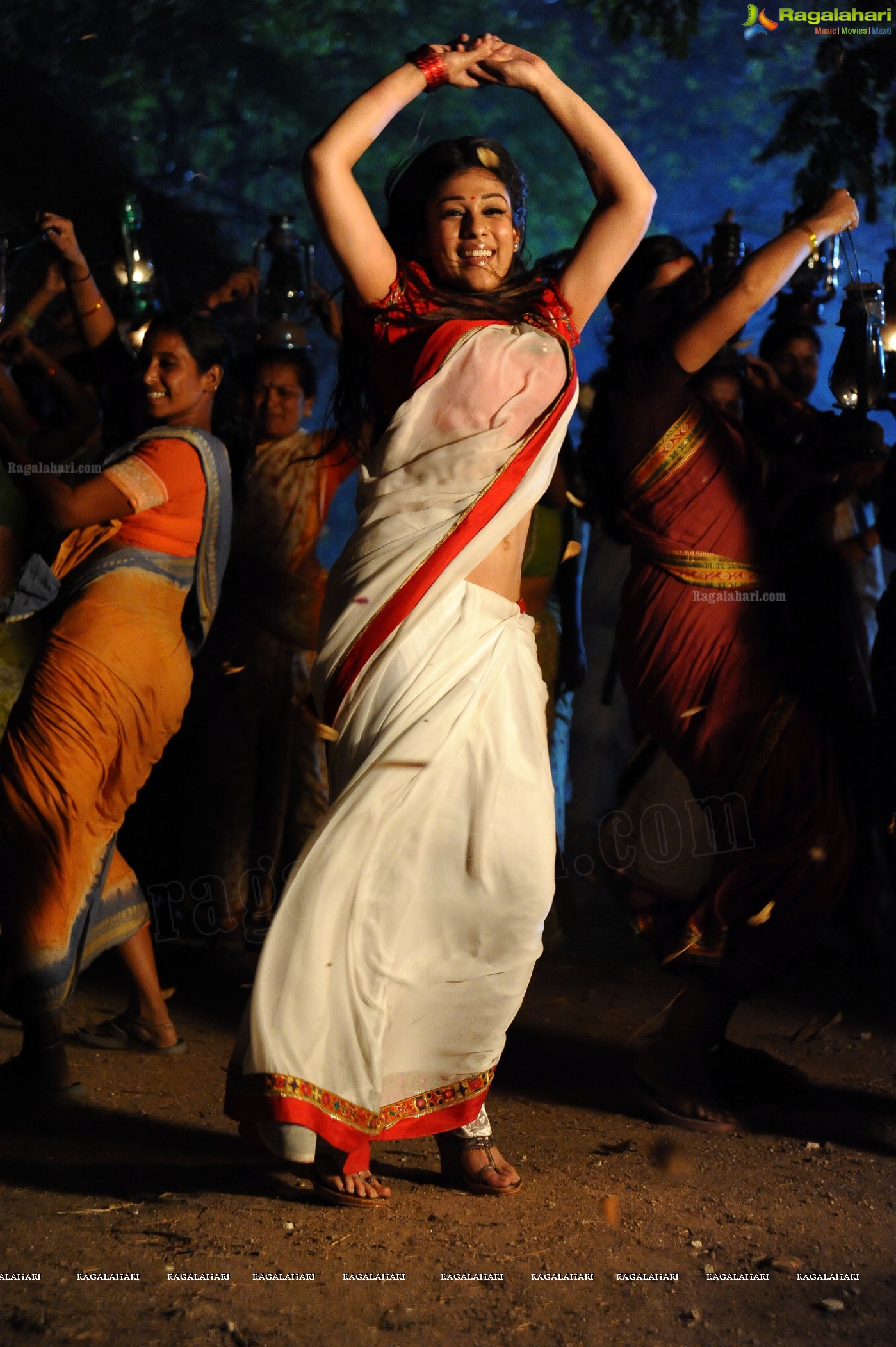 Nayanthara Stills in White Saree from Krishnam Vande Jagadgurum Song, Images