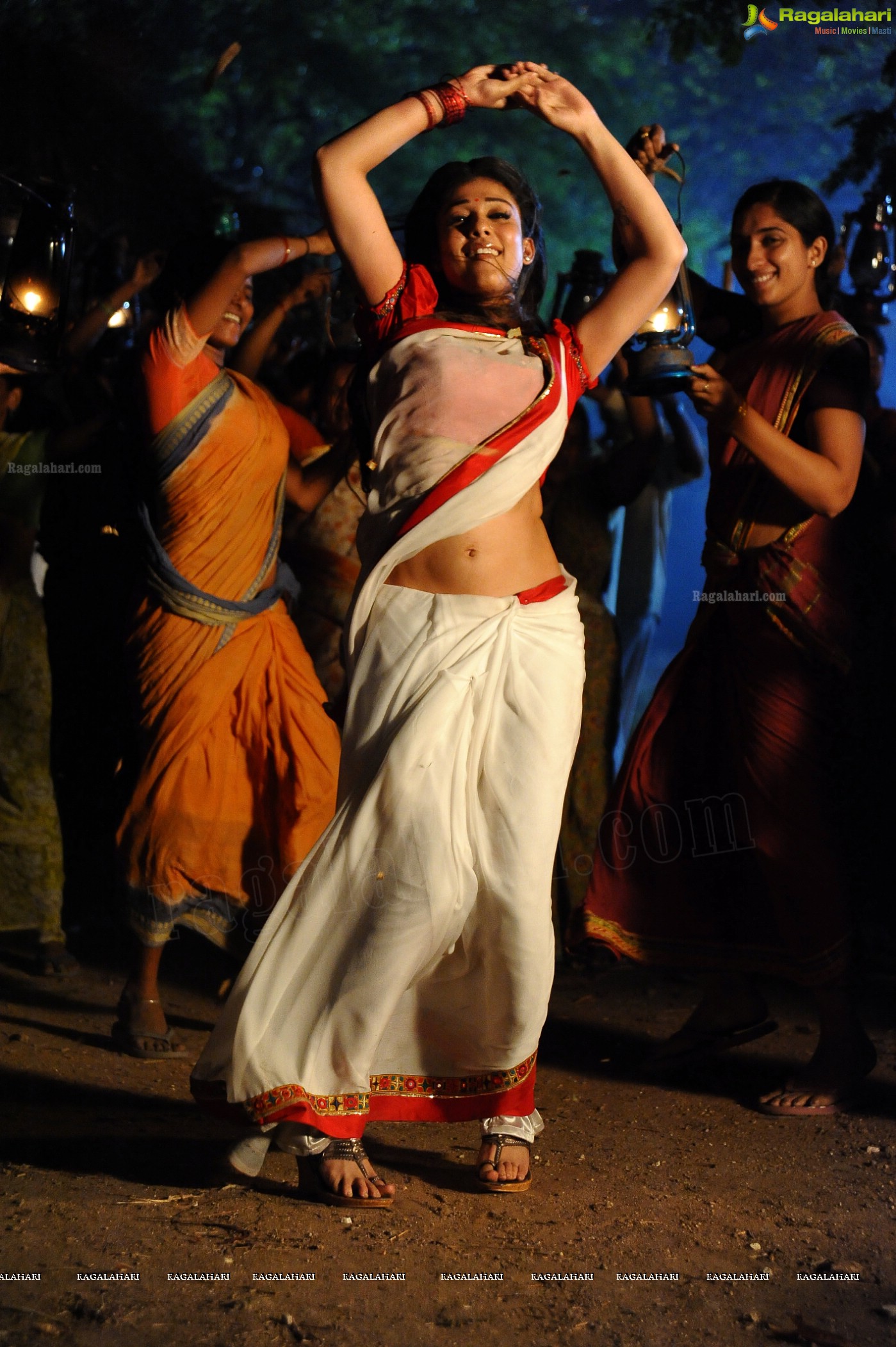 Nayanthara Stills in White Saree from Krishnam Vande Jagadgurum Song, Images