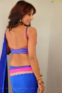 Sanjana posing in low back saree blouse