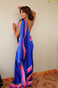 Sanjana posing in low back saree blouse