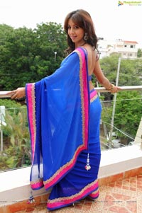 Sanjana posing in low back saree blouse