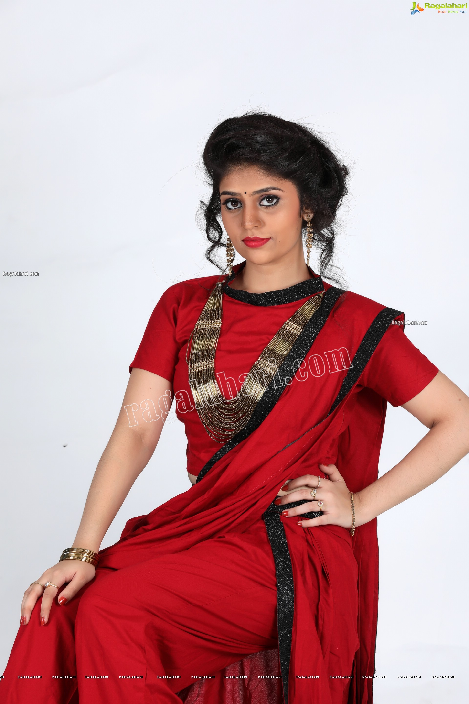 Viswa Sri Bandhavi in Red Dhoti Saree Exclusive Photo Shoot