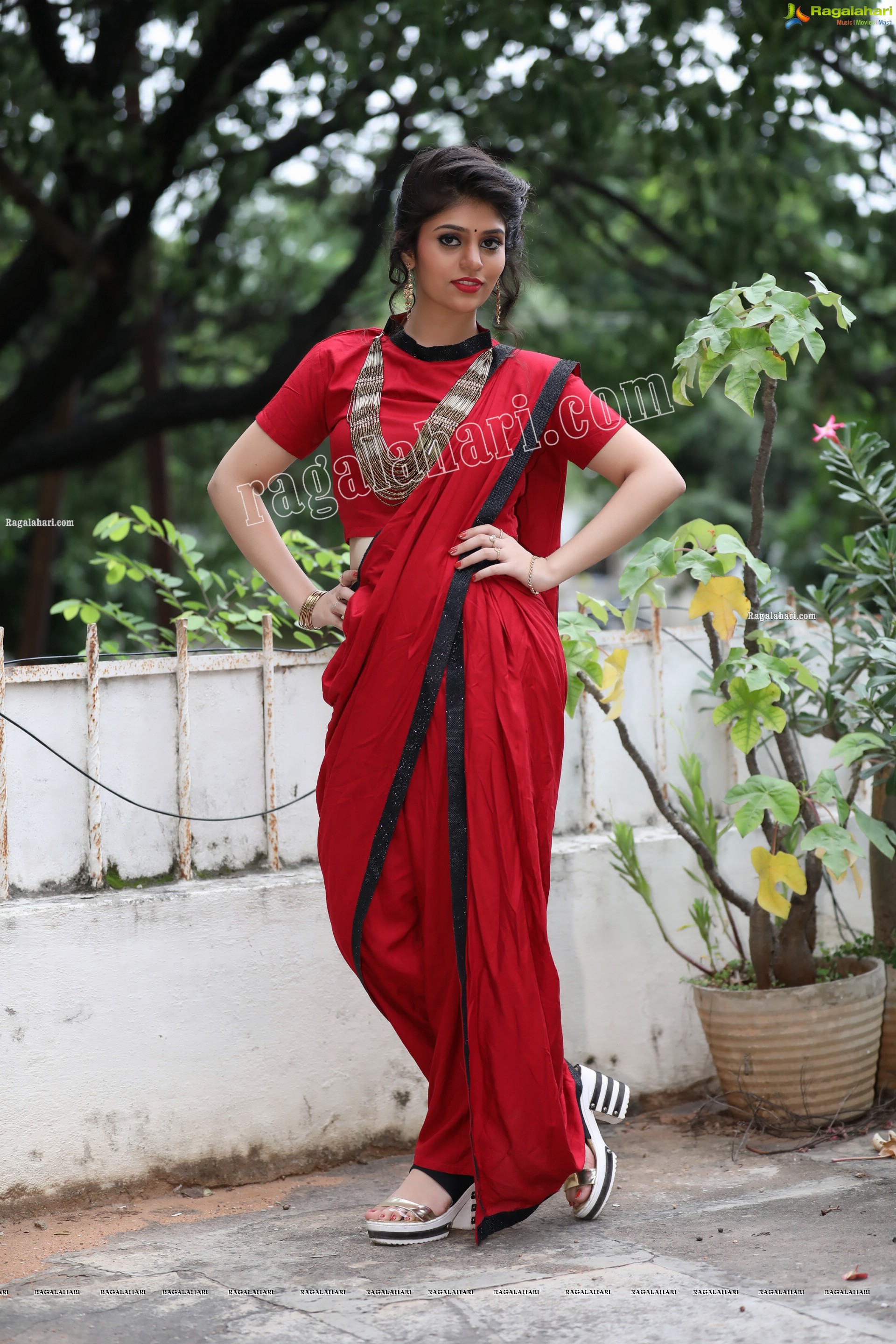 Viswa Sri Bandhavi in Red Dhoti Saree Exclusive Photo Shoot