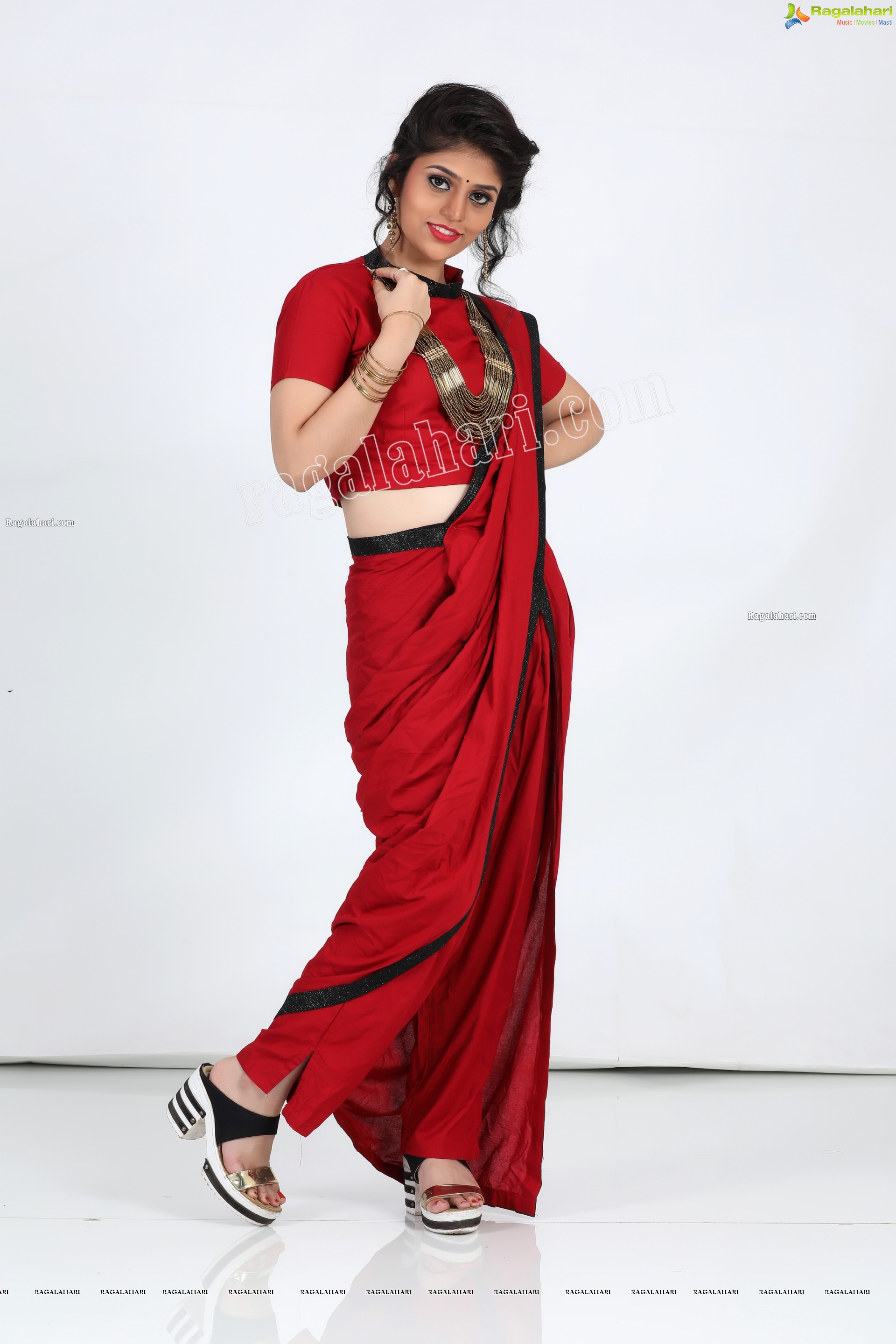 Viswa Sri Bandhavi in Red Dhoti Saree Exclusive Photo Shoot