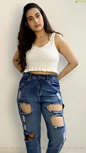 Manjusha in White Smocked Crop Top and Ripped Jeans