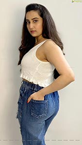 Manjusha in White Smocked Crop Top and Ripped Jeans
