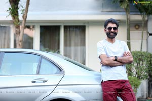 Kiran Talasila Poses in Style With a Car