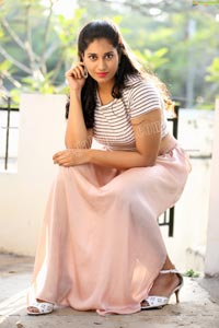 Akhila Ram in Pastel Pink Skirt and Stripes Top