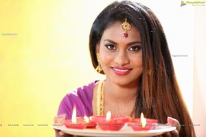 Priya Augustin Holding Diya