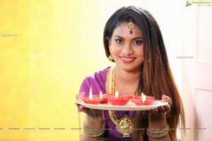 Priya Augustin Holding Diya