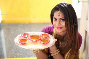 Priya Augustin Holding Diya