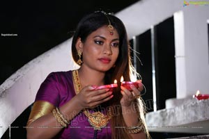 Priya Augustin Holding Diya