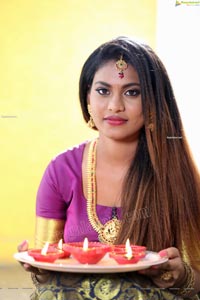 Priya Augustin Holding Diya