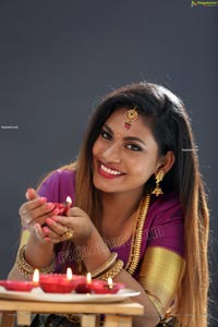 Priya Augustin Holding Diya