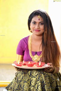 Priya Augustin Holding Diya