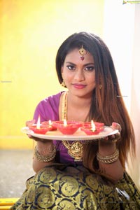 Priya Augustin Holding Diya