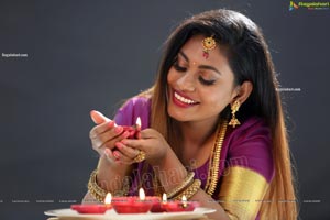 Priya Augustin Holding Diya