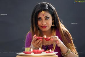 Priya Augustin Holding Diya