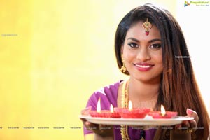 Priya Augustin Holding Diya