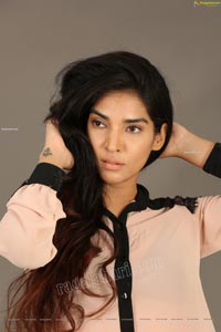 Supraja Narayan in Pastel Pink Shirt and Black Shorts