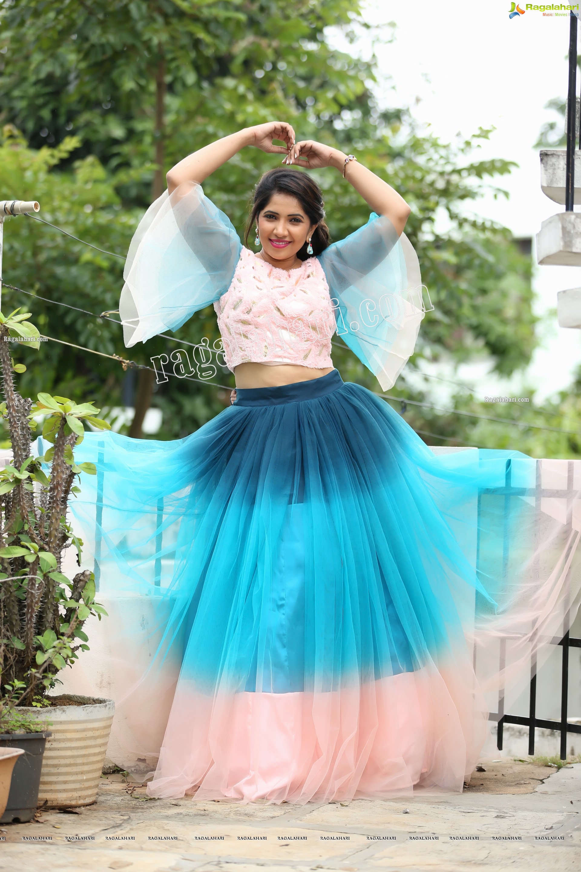 Indu in Bell Sleeves Pink Crop Top and Sky Blue Net Lehenga Exclusive Photo Shoot