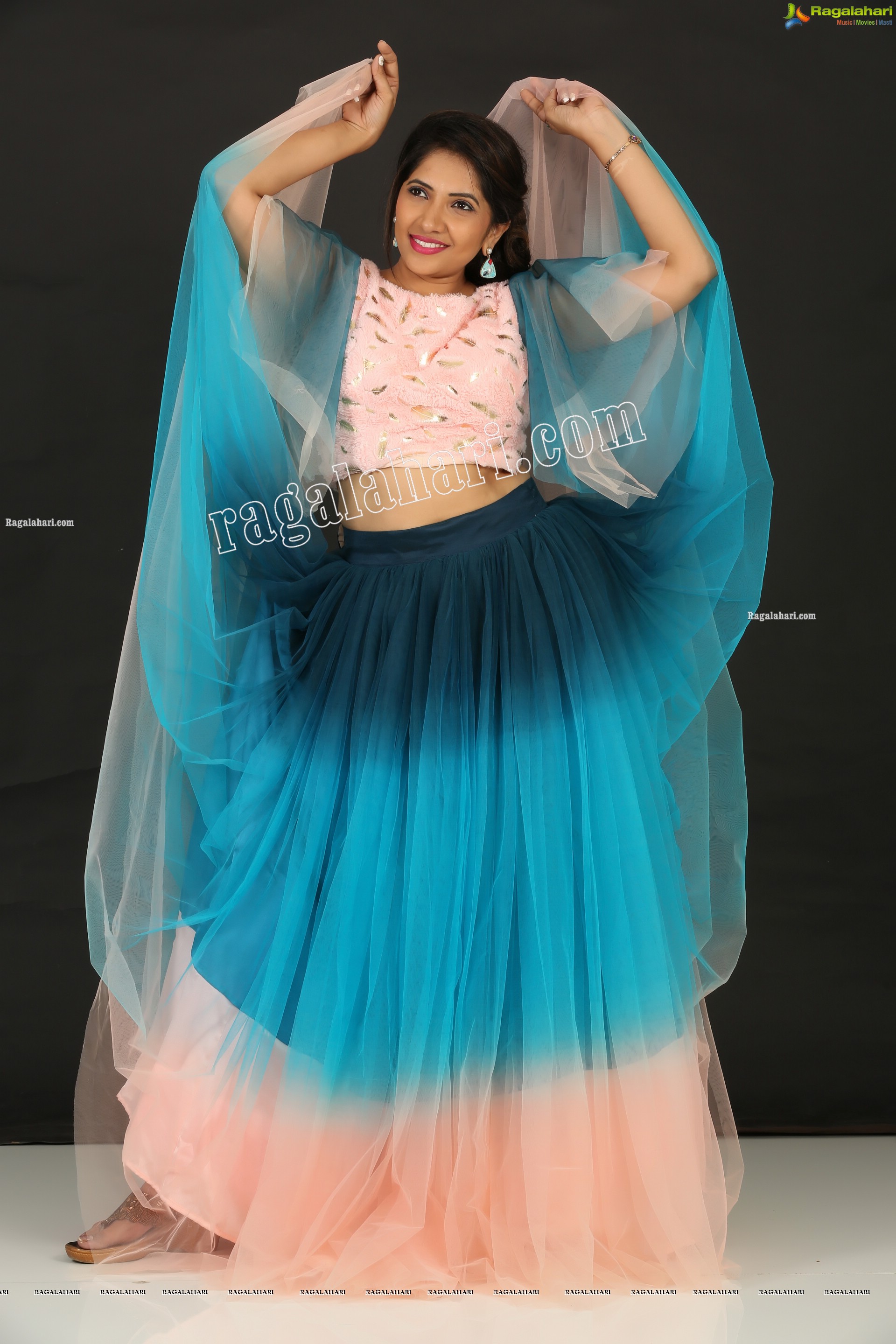 Indu in Bell Sleeves Pink Crop Top and Sky Blue Net Lehenga Exclusive Photo Shoot