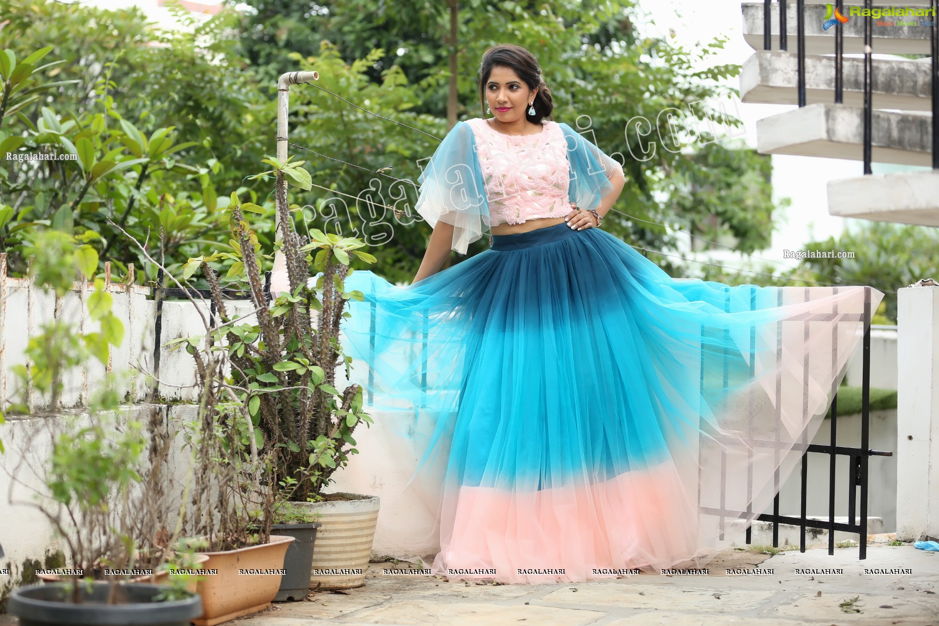 Indu in Bell Sleeves Pink Crop Top and Sky Blue Net Lehenga Exclusive Photo Shoot