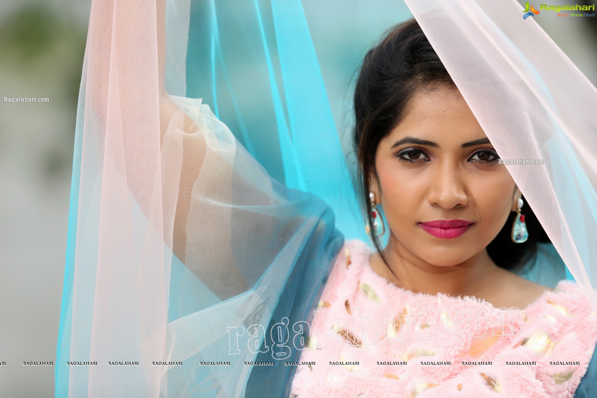 Indu in Bell Sleeves Pink Crop Top and Sky Blue Net Lehenga Exclusive Photo Shoot