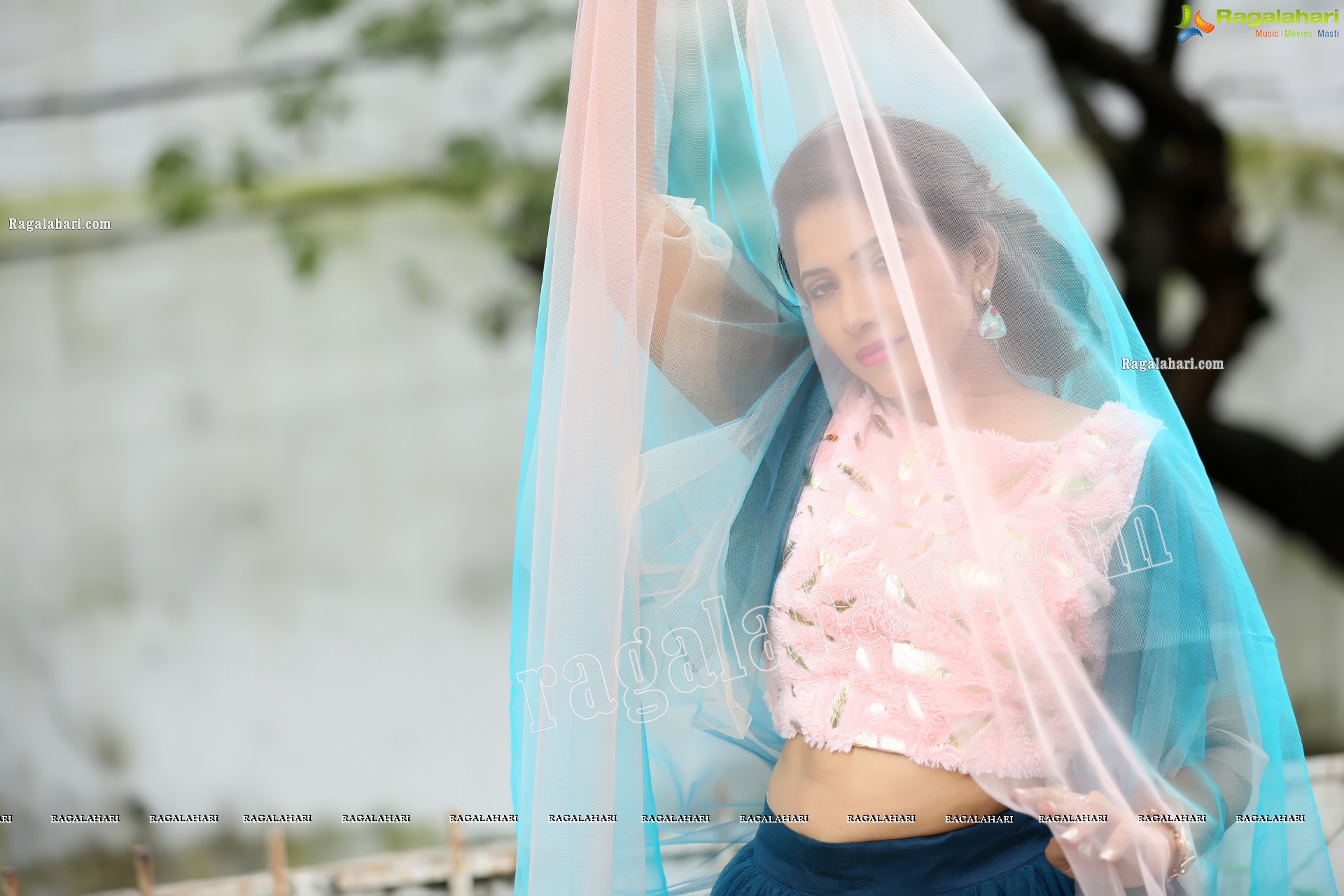 Indu in Bell Sleeves Pink Crop Top and Sky Blue Net Lehenga Exclusive Photo Shoot