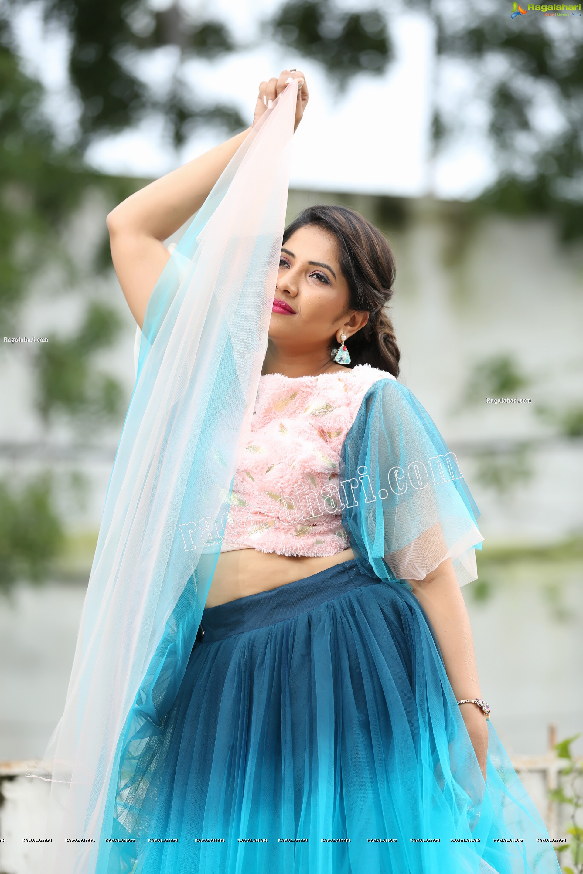 Indu in Bell Sleeves Pink Crop Top and Sky Blue Net Lehenga Exclusive Photo Shoot