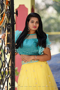 Anusha in Yellow Lehenga and Blue Crop Top