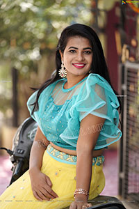 Anusha in Yellow Lehenga and Blue Crop Top