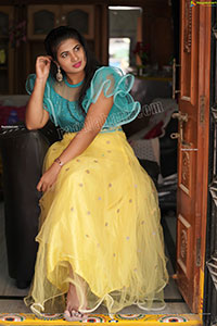 Anusha in Yellow Lehenga and Blue Crop Top